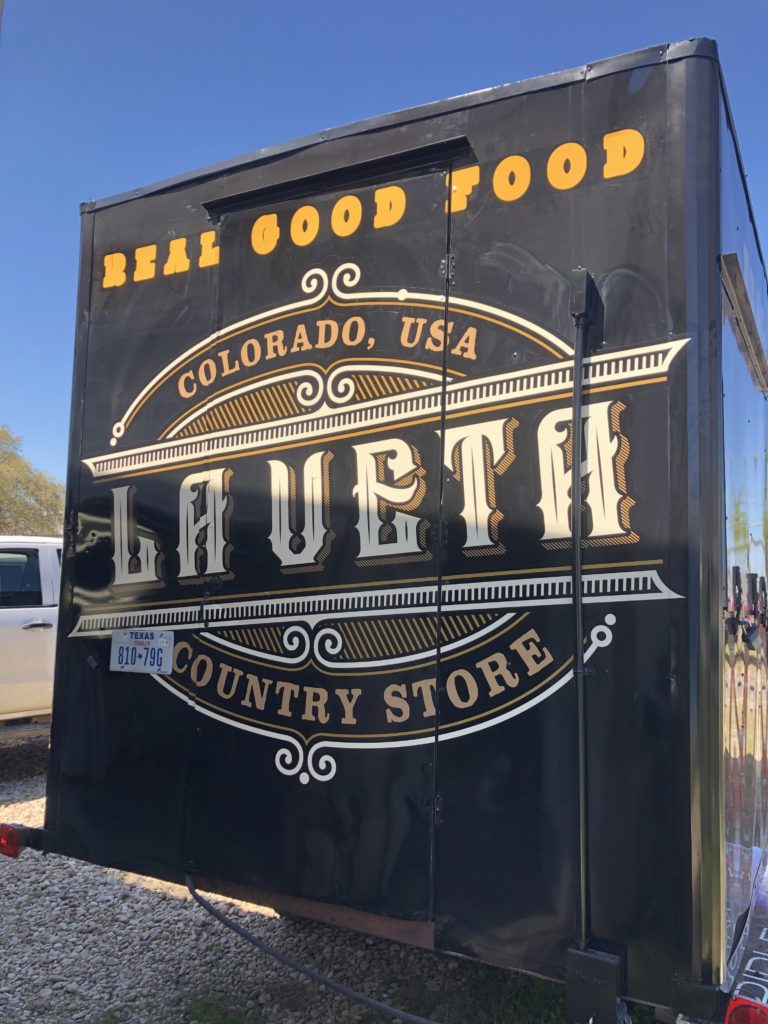 Laueta country store logo with black background